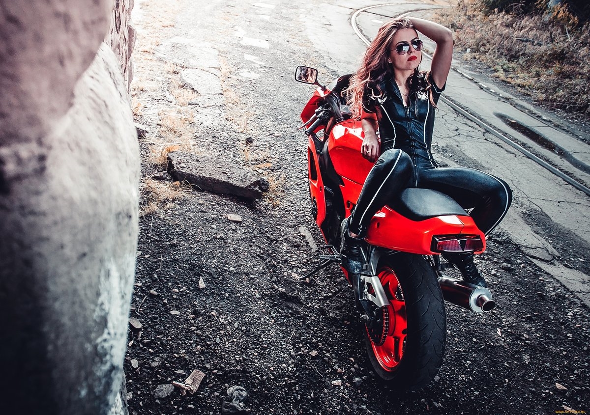 Blondes on a motorcycle in Santiago de Cuba